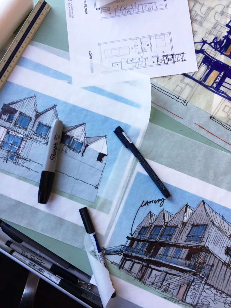 Architectural drawings and sketches of multi-story buildings with pens and ruler.