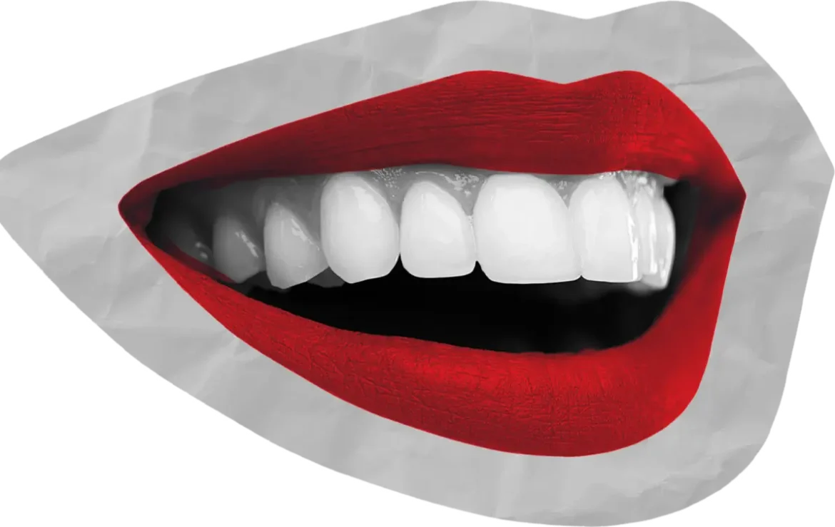 Bright white teeth with bold red lipstick against a grey and black background.