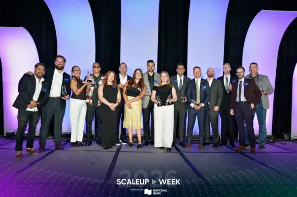 Scaleup Week award recipients celebrating on stage with trophies