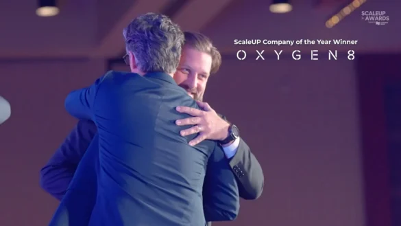 Men hugging at ScaleUP Awards, celebrating Oxygen8 company of the year win