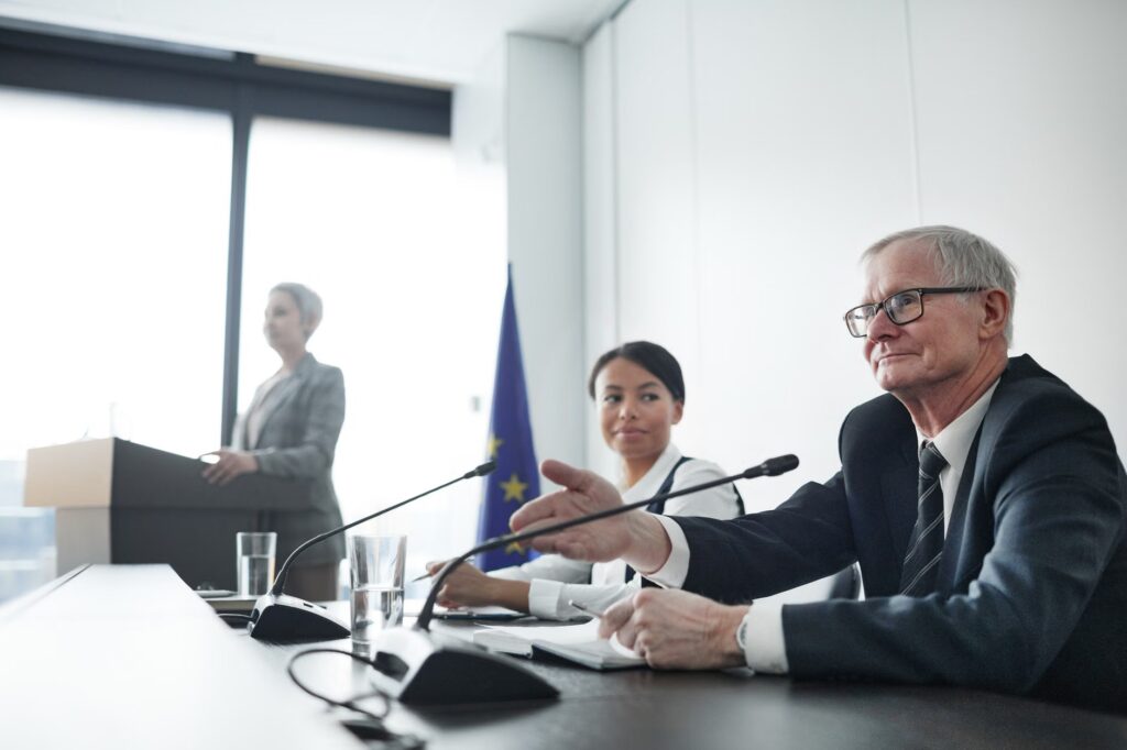 Panelists at an EU conference discussing law and diplomacy.