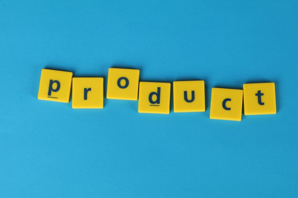 Yellow tiles arranged to spell 'product' on a vibrant blue background, ideal for creative design and marketing m...
