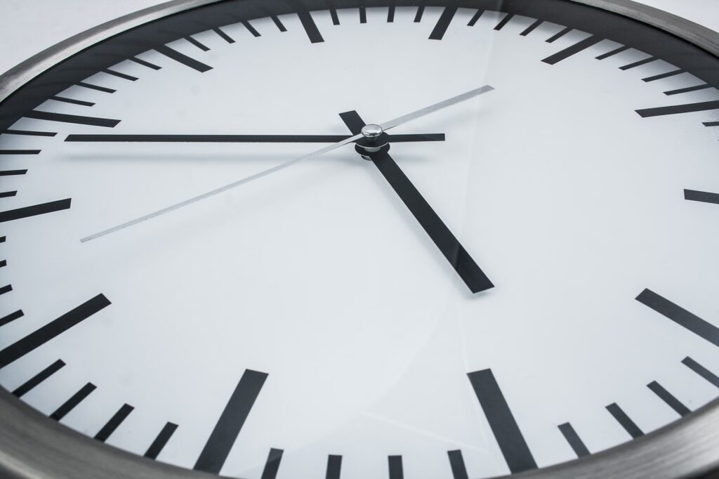 Detailed close-up of a modern analog wall clock displaying time and precision.
